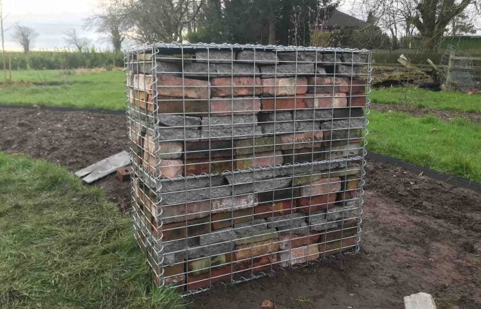 A full gabion box using reclaimed garden materials