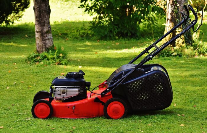 A red petrol powered lawn mower