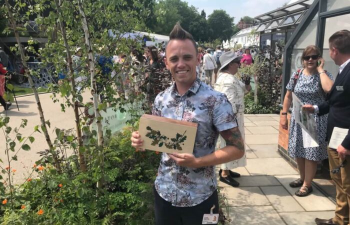 Garden Ninja holding his Chelsea Award