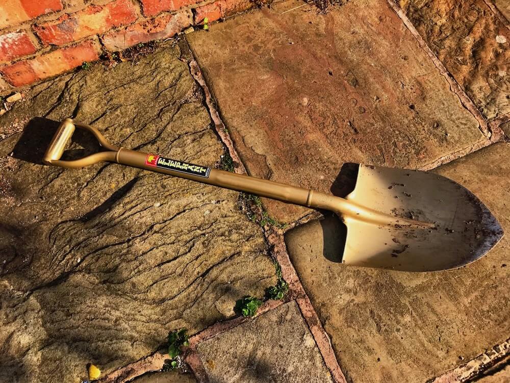 A golden spade on the floor