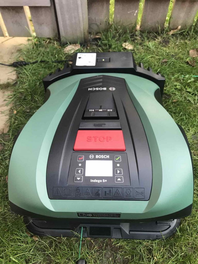 Bosch robo mower on its docking station