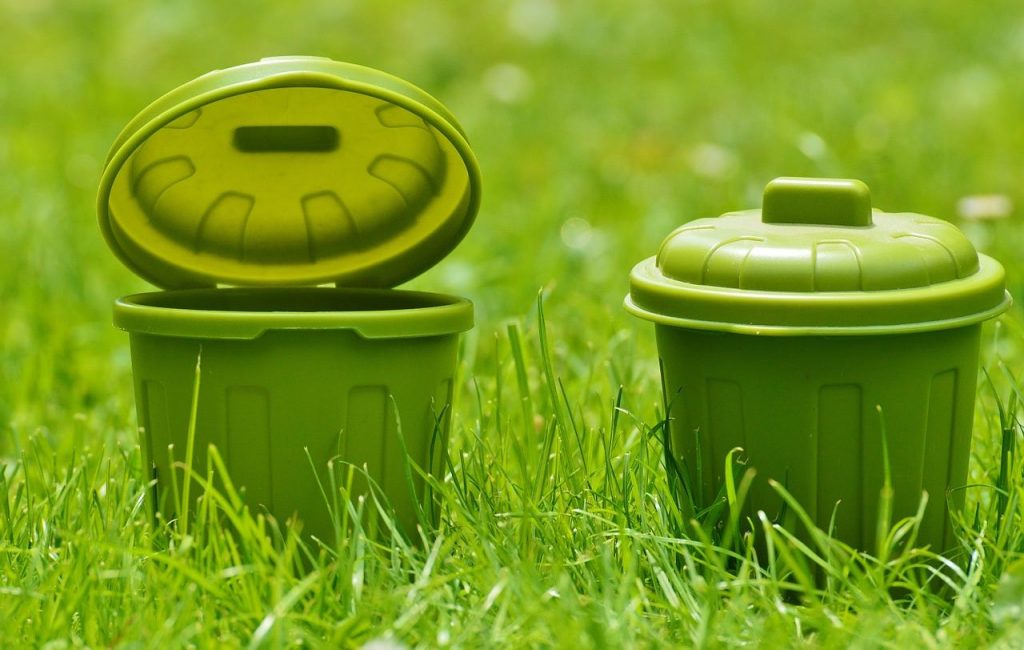 Green plastic buckets on turf