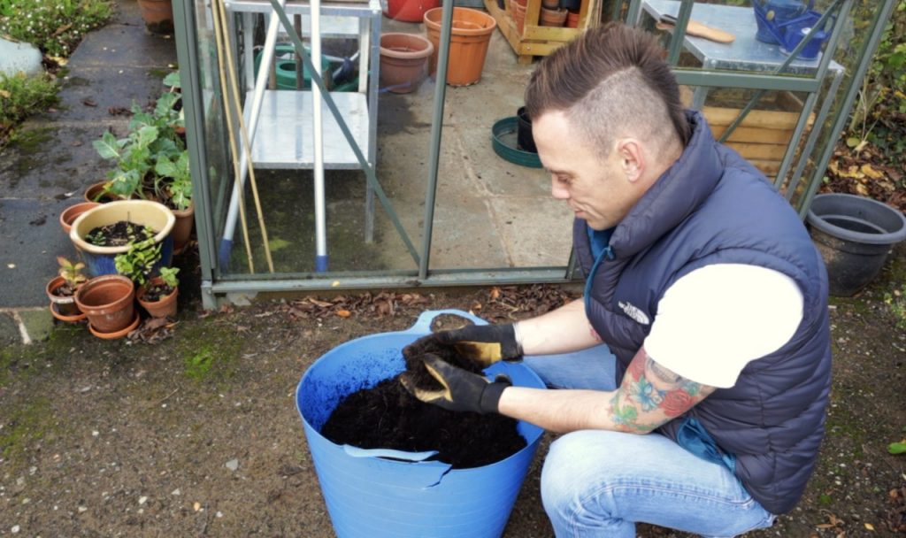 Garden ninja preparing used compost