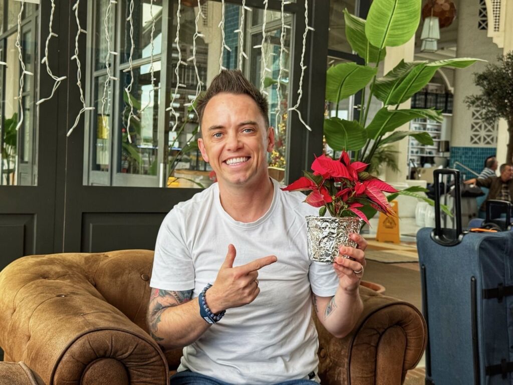 Lee Burkhill holding a poinsettia